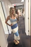 I love this dress so much! I purchased it without an event in mind, but ended up bringing it to a girls' weekend and have since worn it out to dinner and to work, so it's very versatile. The material is thick, which I like, and it's a bit stretchy, so it might not be the best for a really hot day if you are going to be outside. I found the dress to be very flattering! - Laura C.