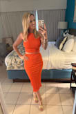 I loved the set and decided to buy it to bring on vacation! I would say it runs a bit on the small side but wouldn't size up if you like fitted items. It is an elastic material, so I wore this without a bra, and I got a lot of compliments! It's nice because you can wear it as a set, or you can separate the pieces to wear separately. - Laura C.