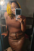 It's cute and warm. I can see myself putting a sheer turtleneck under or a button-up. In person, it's not a red, more brown. - Wlehglowdieh B.