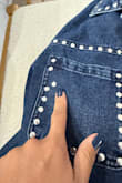 I love the jacket shirt, but the silver studs keep coming off. One of the studs on the front pockets came loose. - Maria T.