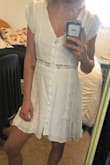 loose but not in a "too-large" kinda way, just enough room to move around in and such. I was wearing red underwear when i tried it on at home and you could see it from behind so i would suggest wearing underwear that matches your skin color with it! otherwise it's super cute and just needs a de-wrinkling. gonna use this dress for my grad photos! - Carrie D.