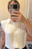 This fits true to size! I wear it under a jacket because the shoulder area kind of sticks out on my wider frame. I really love that it's not sheer or see through! There's an extra layering to prevent seeing your bra, so no undershirt is required. Not too warm with the extra layer either. Would recommend! - Katie C.