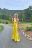 The bride herself felt I would look good in a yellow so I gave it a shot just to make her happy and I was impressed on how much I liked it. It's pretty YELLOW but the way it fit was classy and I got compliments the entire night.
I went with a small which fit decently the straps on the back could have been a little more quality of a fit. The train was long but the front could have been an inch longer for the tall girls.
I loved it overall and gave it a good steam since the material was a tad cheap.
But the assignment was understood and the compliments were plenty so for a one time use, I'd call this a success! - Bridgette D.