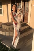 The fit was a bit snug but not super tight, the material is amazing! I wore It for my engagement pictures and I absolutely loved it! It was a bit long but I wore 4 inch heels and didn't have a problem! - Anahy C.