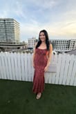 I thought the fit was extremely flattering! The material is very stretchy. My pregnant friend was actually able to borrow this dress, and it comfortably fit her bump too! I did find the outer layer of material thin, so it pulled easily with my fingernails, and the boning wasn't very stable, but overall, a solid dress! - Gina G.