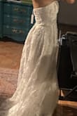 This dress is perfect! It transforms once you put it on your body! I initially was not thrilled when I saw the beading, but once it was on, I was in LOVE! It fits beautifully! It's a little large in the bust for me, BUT I have very small breasts, so that's expected with any wedding dress! I highly recommend this dress. I am wearing it for an elopement; it is long so I will need it altered. Again, any dress would need this. - Shiloh L.