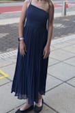 Amazing dress, perfect for hoco did put skin-to-dress tape on the no-strap side I don't think I would have been comfortable without it. The no-strap side hit a little too low for my comfort. - Avery T.