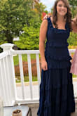 I got this for my 14-year-old daughter for homecoming. I loved that it was modest, she loved that it was elegant and she felt beautiful. We ordered a medium, which fit the bust and waist, but the shoulders were way too big. A smaller size would have been too small around the midsection. So I just sewed the shoulder straps back, and pinched the corners where the neckline meets the shoulder straps. - Robin S.