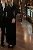 I loved this dress. I wore it to a fancy dinner, sooo pretty. I felt so elegant. The material is relatively stretchy. I ordered a size XS; I would've probably been fine in a Small also, since it is tight & stretchy. The drape and slit are so flattering. - Gabby V.