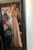 This dress is exactly what I imagined! It fits very true to size and I was surprised at how I didn't really need a bra with it even though I am a DD! You can however wear a strapless bra and nothing shows. I love the lace top and the flowy skirt. - Cara M.