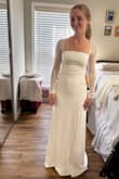 This dress is very classy and timeless. I thought I wanted something more whimsical, with lace and draping, but my mom and I both agreed when I tried this on that it was a winner. Did not feel cheap at all, for the price. - Lexi P.