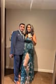 I wore this dress to a gala and loved it.  I did stitch the slits about an inch. I'm glad I did because the wind blew and the middle fabric went in between my legs when I was walking lol.  I'm 5'11 and have very long legs, and even with stitching I still felt sexy.   The bust was a bit tricky because I am not busty, so it was a tad big, but I think if someone is busty it might be too much too.  All in all, the dress is beautiful, super lightweight, and it was the perfect height for me since I'm so tall. - Piera A.