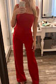 I LOVE this jumpsuit! I was receiving compliments all night. Fit like a glove. I'm 5'4 and it fit with about 4 inch heel. I might hem it in the future. - Brittany I.