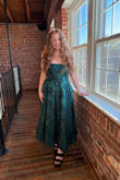 I absolutely love this dress. It was beautifully made, especially for the price. The dress has three layers to the skirt, which gives it a little flow in the bottom, which I loved. I am very short, 5'1 so the dress doesn't quite fit like the picture shows on a more petite frame. It hit me right at the ankle instead of mid-calf like the photo shows, but I didn't mind. Definitely would recommend - Danielle H.