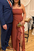 I bought this dress for a wedding I was attending and got so many compliments. The fit was true to size, and it was very flattering on my figure. I'm mid-size, 155 lbs, and 5'3. - Isabela G.