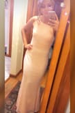 Bought this dress to wear for 2 weddings and it was just as stunning as it looks on the model. Fits like a glove. I'm pretty tall (5'7"-5'8") but i still had to have it hemmed a little even with my heels on. It accentuates your curves in all the right ways, even if you don't really have many (like me, i'm fairly athletic build). I got so many compliments. I'd def wear it again to any formal event. The lacy fabric is fairly stretchy though, so be careful not to hook it on jewelry or other people's clothing, etc. - Maggie L.