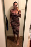 This dress is absolutely stunning in the plum floral. It's very comfortable. I actually bought both sizes, small and medium. Both fit, but small looked better. Be cautious with the zipper, as it doesn't glide easily. I received tons of compliments. Fabric is very soft. - Tasha N.