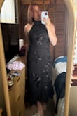 Very pretty and stretchy. If I got a size medium I think it would have been more fitted (which I would have hated), but if you like that I'd size down. - Amber G.