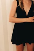 This dress is ridiculously flattering. It has a great neckline and the length (with the shorts underneath) really made my legs look longer and thinner. Also a plus- I didn't have to wear a sticky bra due to the thickness of the material! A total go-to LBD. If you are on the edge, definitely purchase... you will not be disappointed! - Kelsey L.