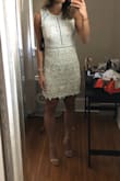 Beautiful dress, but definitely looks white in pictures. Overall the dress fit true to size, but the piece of lace that goes around the rib cage has absolutely NO give! So if you're between sizes and don't want to have to hold your breath while wearing this dress I would recommend sizing up. - Emily S.