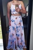 I wore this for a photoshoot and it is my new favorite dress! The fit flatters my body shape in the most perfect way. The top is adjustable so if it is a little big, you can adjust it. The length is a little long, but with heels it is perfect. - Niki B.