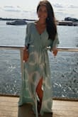 I've worn this dress to many occasions (brunch, rehearsal dinner, baby shower) and love it. It's very comfortable. The top is a tiny bit loose but the string helps secure it. I only needed a small heel and it fit great. - Elyse J.