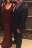 Fits like a glove and accentuates curves like nobodies business. The v bust is not too low but does show cleavage. I thought it looked quote tasteful, yet sexy. Thick material and great lining eliminated my need for spanx and honestly, could go without a bra as well, if desired. Beautiful dress. - Megan M.