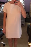 I ordered a size S and it fit perfectly but in my opinion, it doesn't look like the photos at all. It's a very thick material and it looks very boxy. I thought it would be more of a shift dress but it doesn't move like one. - Bailey B.