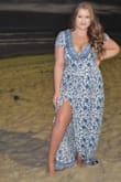 I just wore this dress on a beach vacation and got so many compliments! It runs a little small, but I am curvy as well. My only complaint is the slit ran very high up and I ended up having to safety pin it to keep it in place. Overall this dress is beautiful! - Lindsey P.