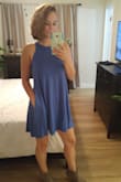 Fits true to size. I would recommend washing cold, I feel like it shrunk a little. I love that it has pockets. Because it's a swing dress be careful on windy days. Can dress up or down with shoes and accessories. - Rebecca T.
