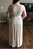 It's a linen-like fabric and not as flowy and long as some of the other Lulu dresses. The back of the dress is awesome! However, the front needs some work. The scalloped pieces in the front just flip forward and the waist band under the top is pretty tight. If you size up for the waist band then the chest area would be too big.
The dress I purchased also had a strap flaw where the adjustable strap was sewn in upsidedown on one side. Pretty obvious.
Would be an ok vacation or summer dress, but it's not dressy enough for a beach wedding bridesmaid dress. - Ashley D.