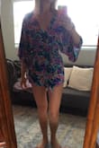 I really like this romper. It is thin and short so I would rec'd more for summertime casual wear versus anything dressy. I am 5'6, it's just below my cheeks, I am concerned about washing it. Bright vibrant colors. Loose and fun but still flattering - Summer B.