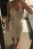 Fits great! The strip around the waist that shows skin is barely noticeable on my skin tone. It covers my breasts enough that you don't see the sag but you also don't need to wear a bra. It hits me just above the knee. It's perfect for something bridal. - Christina A.