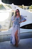 This awesomely, flowy dress fits perfectly! It's tight in the right places and it has a beautiful slit ! I love wearing it and I get compliments every time I do. - Maria G.