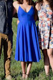 I have such a hard time finding cute "fancy-back" dresses that I can wear without a bra. The strings on the back are awesome for tightening exactly how it fits best and holding everything in place. The outer fabric is a bit wrinkly, but I ironed it and it's held well. The only other concern is that the string in the back has torn open a bit after my first wear. It's super twirly and the color is a really nice blue. I am so excited to wear this all summer! - Emily B.