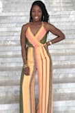 Purchased this jumpsuit for a destination wedding. It was a hit!! Fit great and felt amazing on my skin. When worn with 5 inch heels it's the perfect length. It dragged a little once I switched to flat sandals. Straps are adjustable for those with a smaller bust and it was easy to get in and out of. - Zadia M.