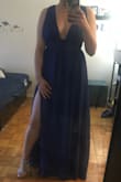 This dress fits me perfectly. I don't have to get it altered and I love the way it looks! The only problem was I would definitely have to wear it without a bra because the dress wouldn't zip up all the way if I had my bra on but I probably wouldn't have wore one anyway. Here's a photo so you can see what it looks like :) - Kiara D.