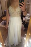 First time buyer and so so happy with this dress! Bought it for my wedding dress and it's absolutely stunning.. sexy, yet classic, a bit vintage and boho...you just have to try it on and see in person to truly see how good it looks, pics don't do justice! Didn't expect to like it but I LOVE it. Legit quality, well worth the price! At 5'9 it fits so well I don't even need any alterations, though if you're tall you may want to lengthen the straps as they're a bit tight but not too bad for me. Def recommend! - Dana F.