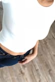 Love how it fits me. I wore it to the gym and also on my high waisted jeans looks amazing. Got both colors white and black. - Tasreen A.