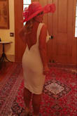 I wore this dress to a Kentucky Derby charity event. Everyone complimented on it. Quality material, fits well and material wore well in humidity. I had to have it hemmed because I am 5 ft tall, but that is typical for me. No complaints, I have a seamstress. Love this dress. Wore in the back helps the form in the back hold. Definitely recommend. - Candy H.