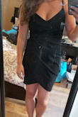 The cut of the dress was very flattering. The ruching in the mid section was very helpful. The dress was stretchy but held me in. A simple dress that I can wear over and over. - Nicole K.