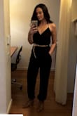 I bought the Medium based on Lulus suggestion and other reviewers, but I should've gone with the large... I have a long torso and at times it felt a little cameltoe-ish (no one could tell) and I could've used a little extra length on the legs. Otherwise, it looked great and felt fine.
The material is thin but not see through, and it looks great with a thin little belt. I'd recommend if you're tall (my height and above) go with the large! - Nicole M.