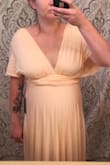 I ordered this dress for my cousin's wedding and it's super comfortable and it fits true to size even with a pregnant belly. The only thing is it does not have great chest support for women with bigger breasts. Other than that it's a great dress and being able to change the top is a bonus! - Moriah D.