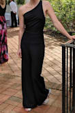 I am very petite so I had the jumpsuit hemmed but it fit PERFECTLY once it was shortened. I certainly recommend this, I got so many compliments at the wedding I bought it for. The back is absolutely stunning. - Megan C.