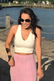 This top fit perfectly! I wore it with a pink high waisted skirt from lulus and it looked great! The material is so soft and comfy. I also loved that I could wear a bra under it without it showing through. The front is thick enough to not be see through at all! - Haley Y.