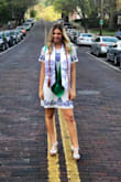 I ordered this dress for my graduation and I loved it! I got so many compliments on it. The shoulders were a little tight when I tried to raise my arms up, but not uncomfortable or restricting in any other way. It was a loose fit from the chest down, similar to a shift dress. I also used a steamer on it to knock the wrinkles out. I know I will find more occasions to wear this dress! - Carly L.