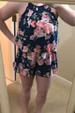 I loved the look of this romper on the model, but didn't end up loving the look of it on me. I have a difficult time finding rompers that are flattering (being short with a larger chest) and felt this was just okay. The material is soft and really comfortable, and the romper has elastic in the waist - good for differing body types. Also, the print placement seemed different than the pictures and I wasn't in love with the placement of the flowers on the one I received. It does fit true to size, I ordered a medium and it fit well - Sarah D.