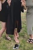 I usually wear a 7.5 and ordered that originally, but it was too big for a shoe like this with only two little straps. Ordered down to the 7 and it fits great. Pretty comfortable, but it is still a high heel, so not meant to be worn all day walking. They are pretty easy to walk in, though - wore them for graduation and didn't trip on the stage or stairs! - Megan M.