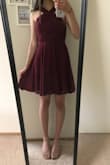 This dress is perfect in all aspects!

Starting with the color: I was worried that the actual color of the dress would be very different from the photos online, but I immediately fell in love with the color as soon as I ripped open the packaging! The dress is a perfect shade of burgundy-- not too purple, not too red. The shades look a little different in my photos, but in better lighting it matches the color as seen online.

Material: I loved slipping on the dress for the first time because of how amazing the material felt! It is light enough that it doesn't weigh you down, but thick enough that it doesn't look or feel low quality at all. The material feels a little chiffon-y and is nice to the touch. I love how the lower part of the dress swishes around whenever I walk.

Fit (most important!): Everything.fits.perfectly. WOW. I had never ordered from Lulus before and was a bit worried, but I did not need to be. Everything from the neck area to the chest and the waist fits flawlessly and the dress itself is very flattering because of its design. 

I highly recommend this dress! You will not regret your purchase :) - Mary S.