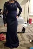 Beautiful dress. The outside feels a little rough but the inside is a little bit softer. It's a little bit long but when I wear heels, it will be okay (I might still have to hold it up but that's okay). All in all, it's a nice dress and looks just like the picture. - Brianna R.